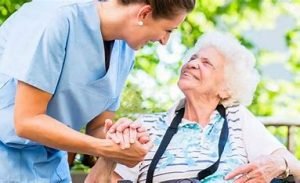 Carer listening to elderly client